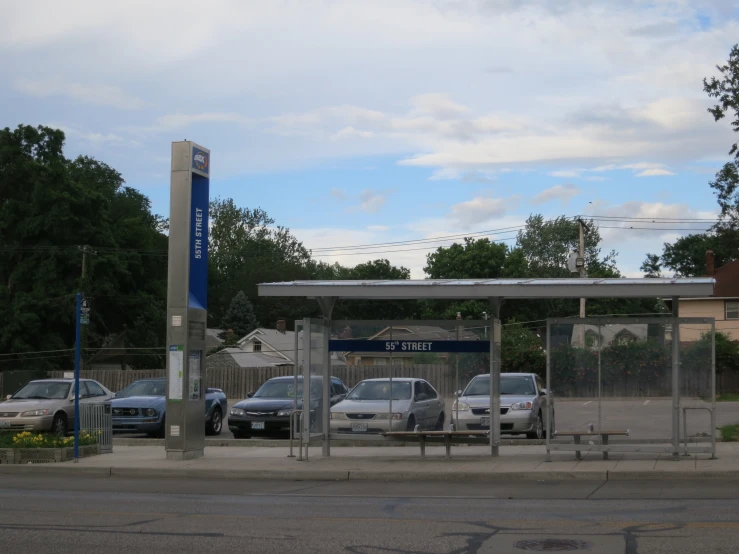 a gas station has several parked cars in it