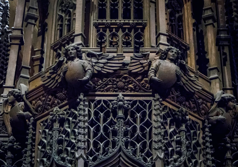 close up po of the iron and wood carving at the front of a building