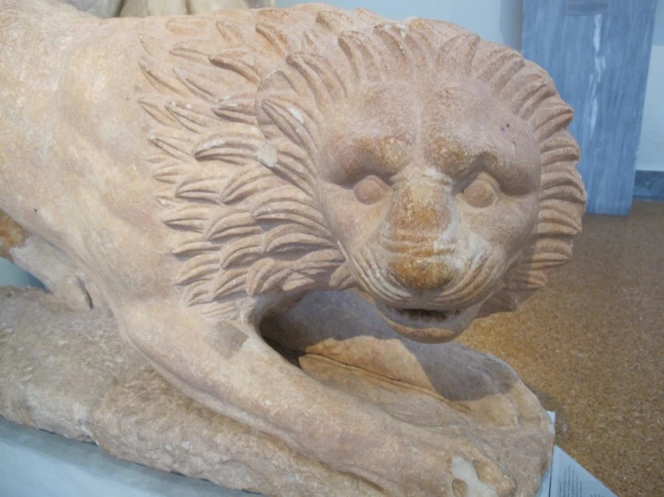 a lion statue sitting on top of a table