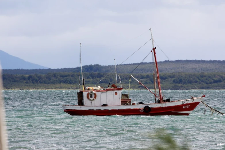 there is a fishing boat on the open water