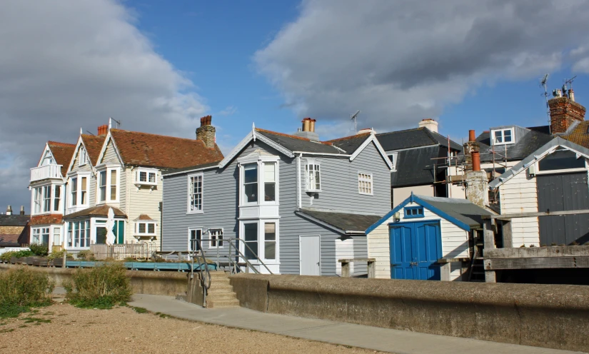 row of multi - family houses on the ocean side