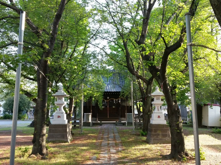 a couple of monument statues on a small pathway