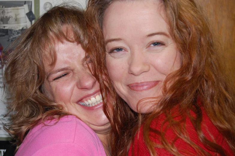 two smiling women emcing in the kitchen