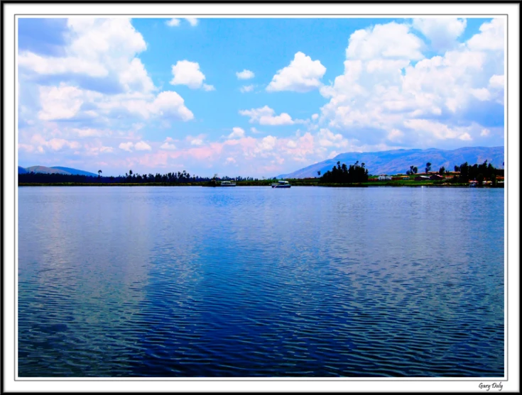 the view from across a large lake to a town