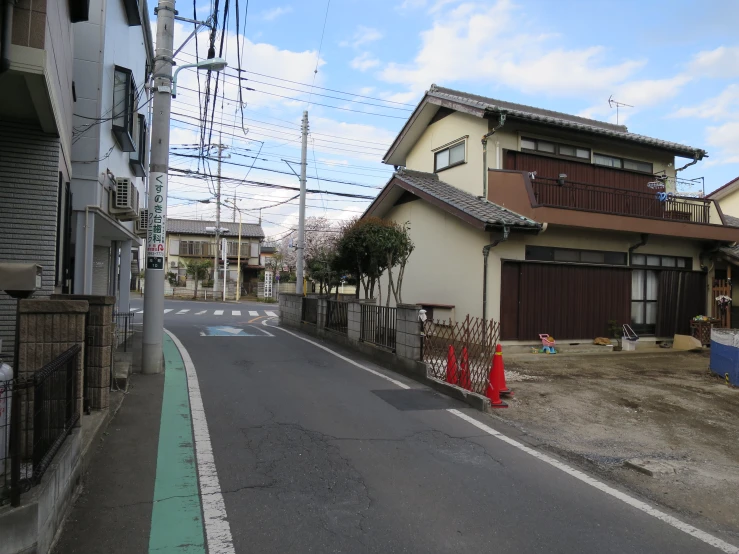 the empty street is right next to the two houses