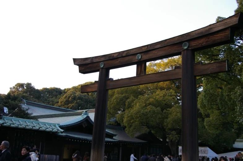 an old wooden gate that has people inside it