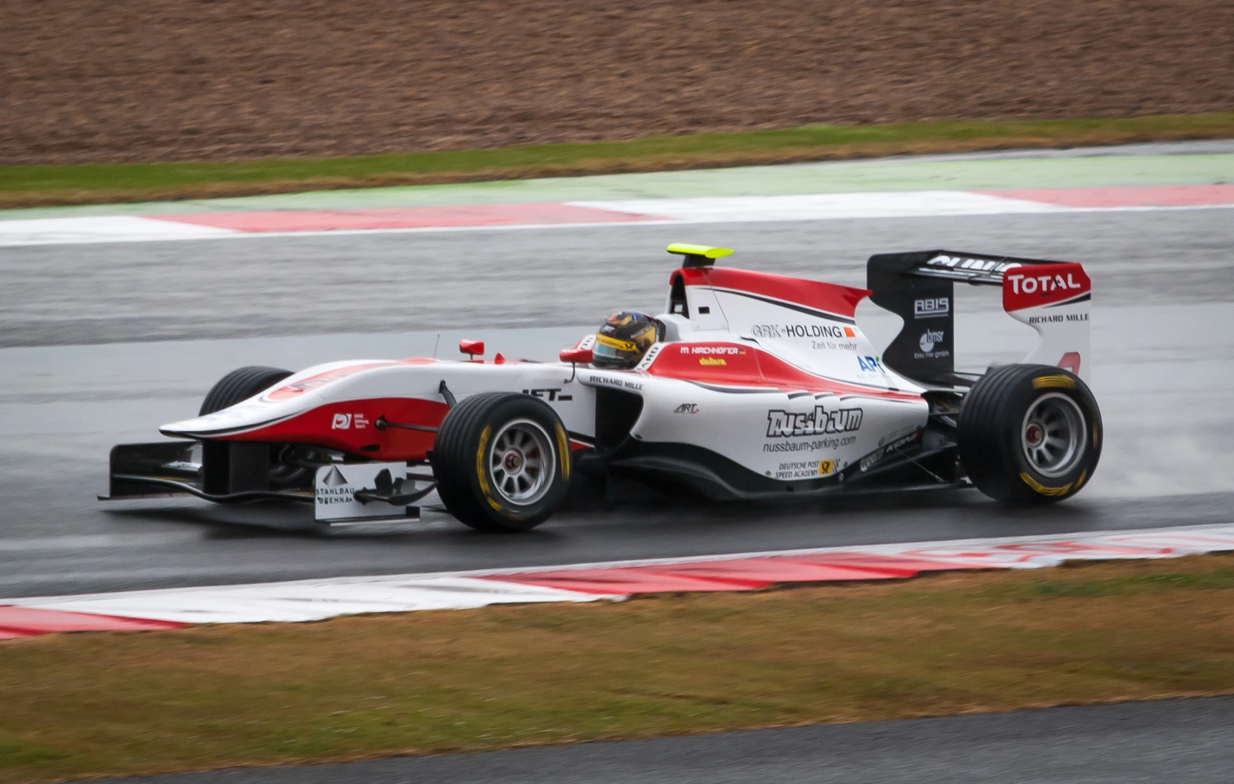 the indy racing car is driving on the track