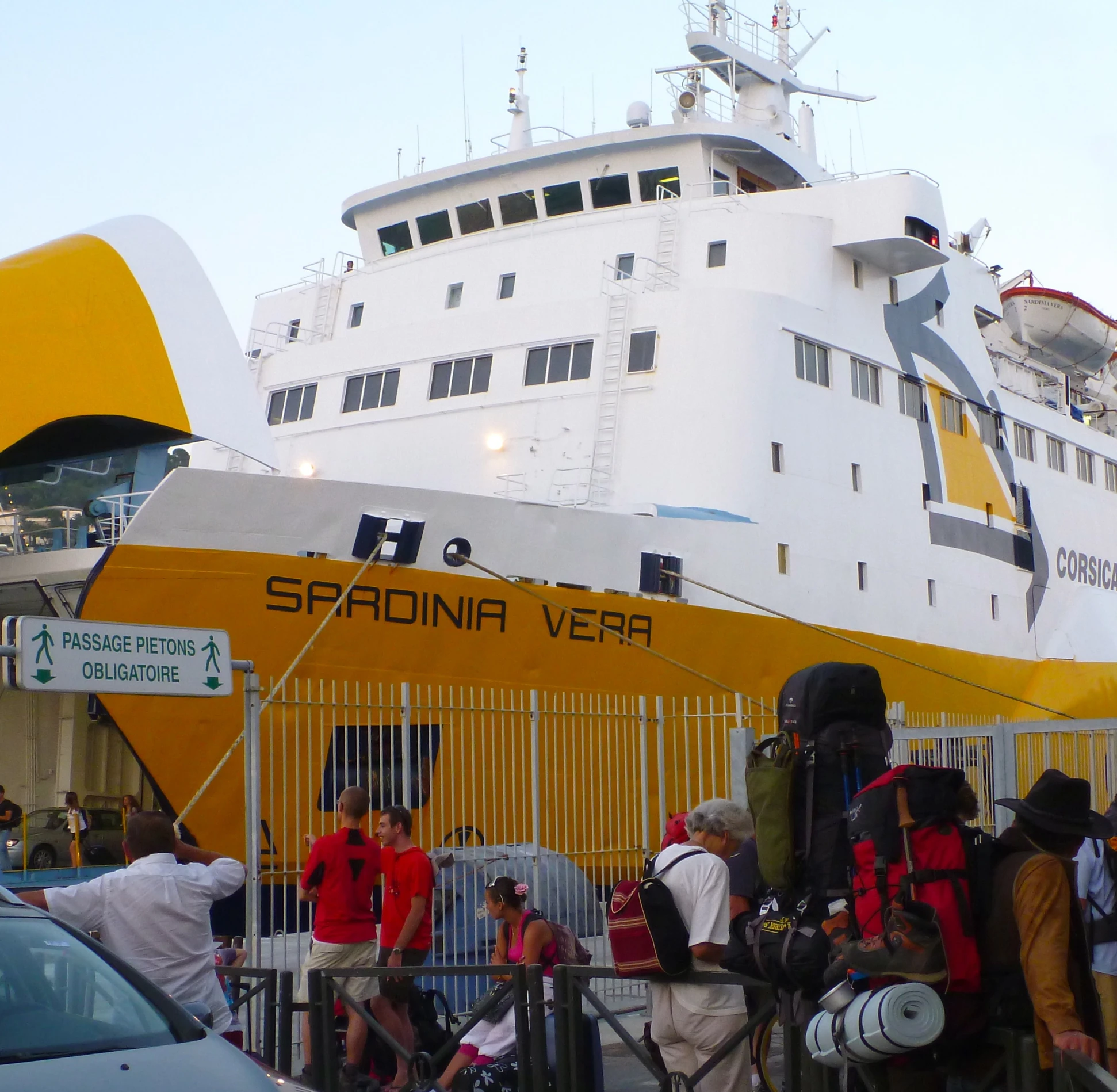 people are standing on steps that lead into a large ship