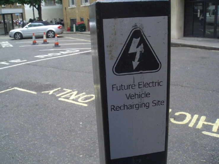 sign on city street indicating the future electric vehicle charging site