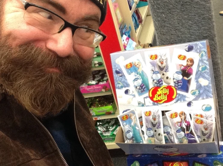 there is a man looking at toy packs