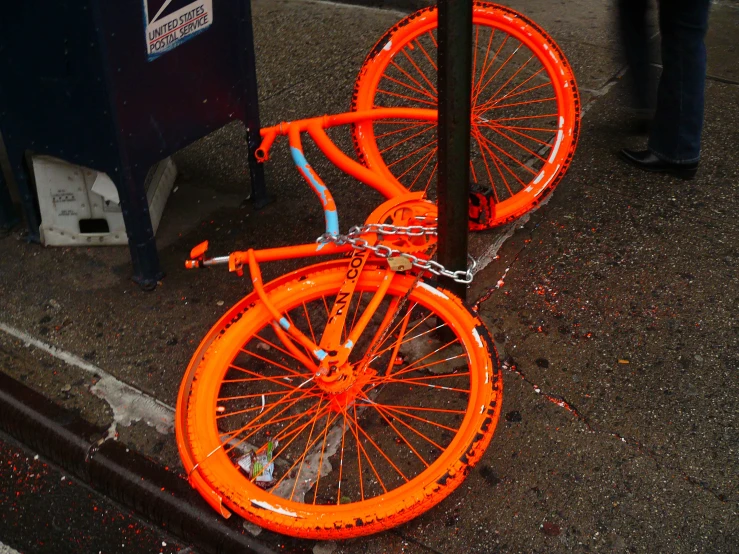 two brightly colored bicycles are parked in a parking area