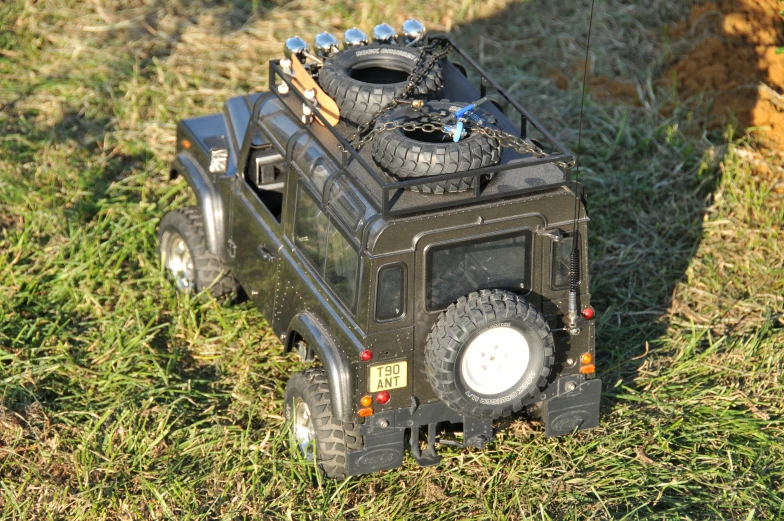 a toy vehicle is parked on the grass