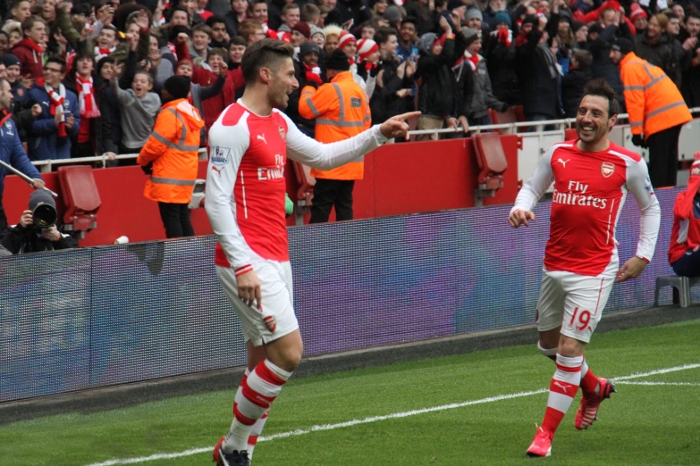 two soccer players celeting after winning the game