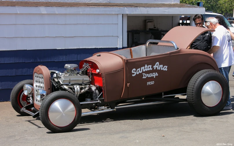 an antique car being displayed for show