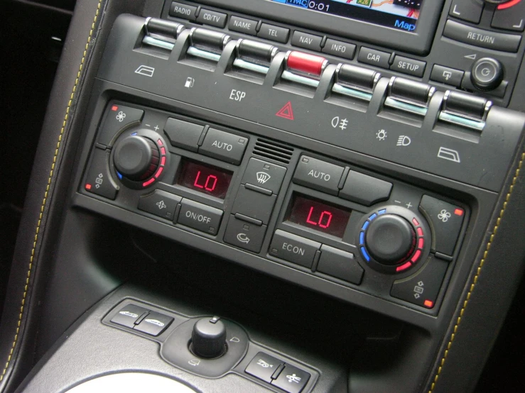 the radio inside a car with dashboard controls