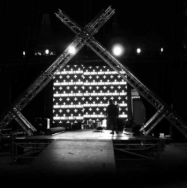 a large white cube in the middle of a stage
