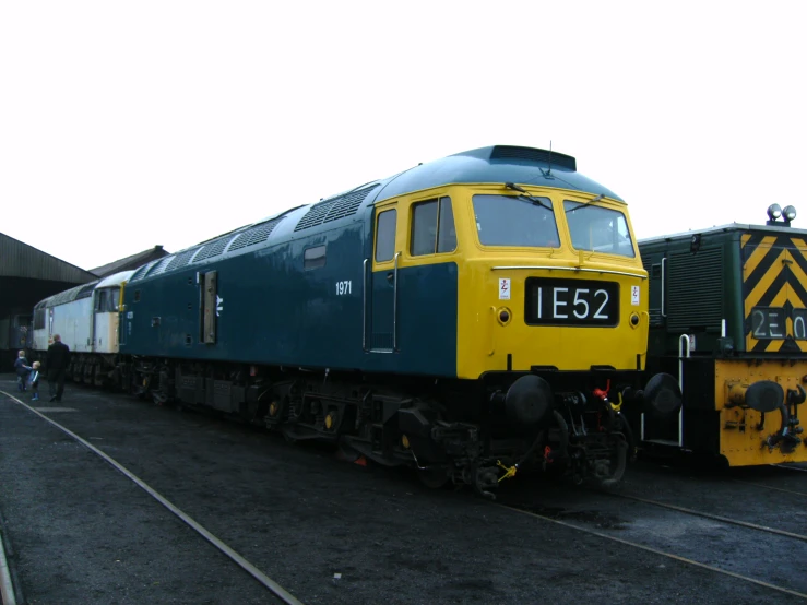 a train engine carrying several carts down a track