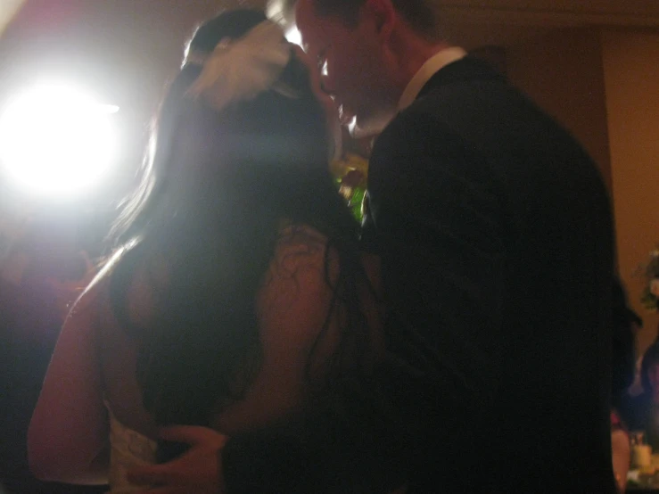 a young couple dance together at their wedding