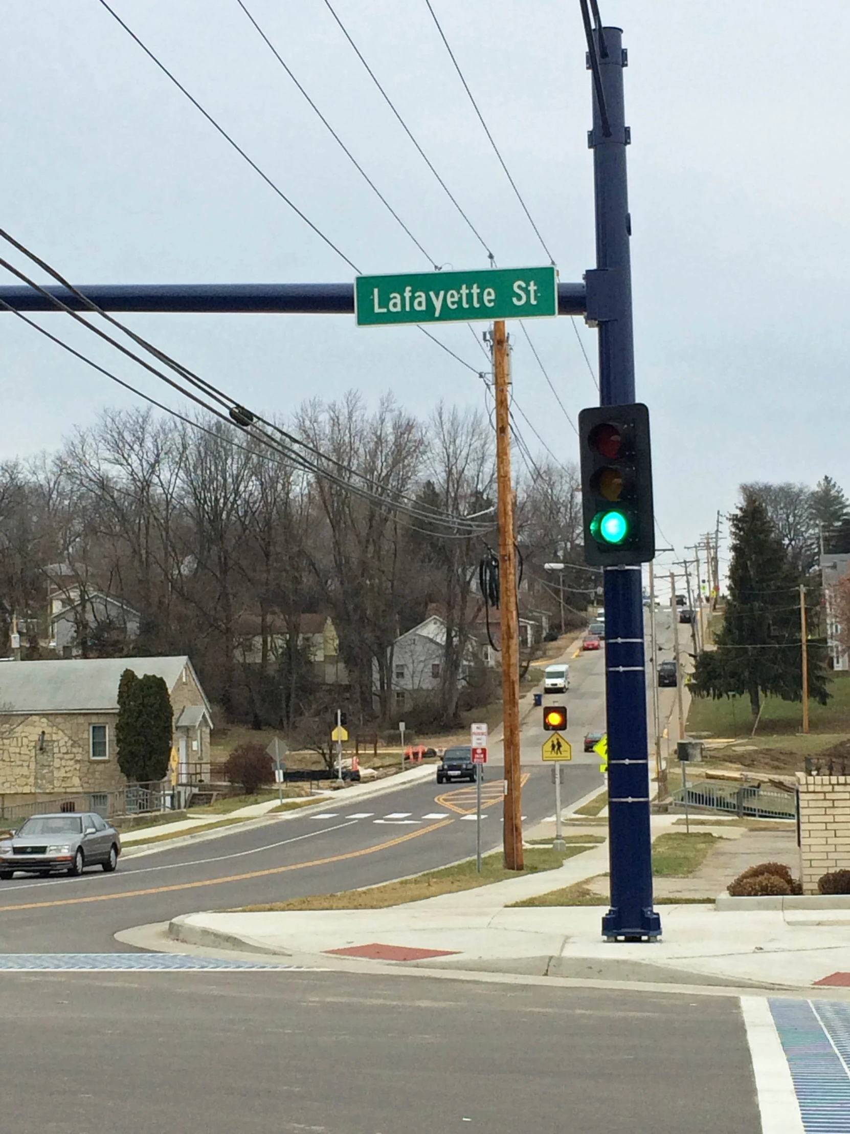 the street sign is lit up for pedestrians to cross the road