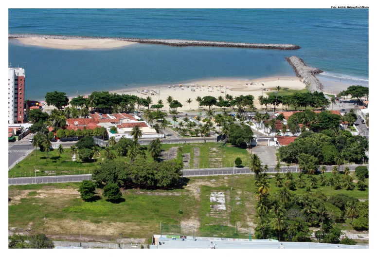 an aerial view of a beach, boardwalk and boardwalk near a body of water