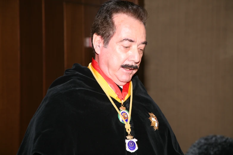 a man in costume has a moustache and is talking