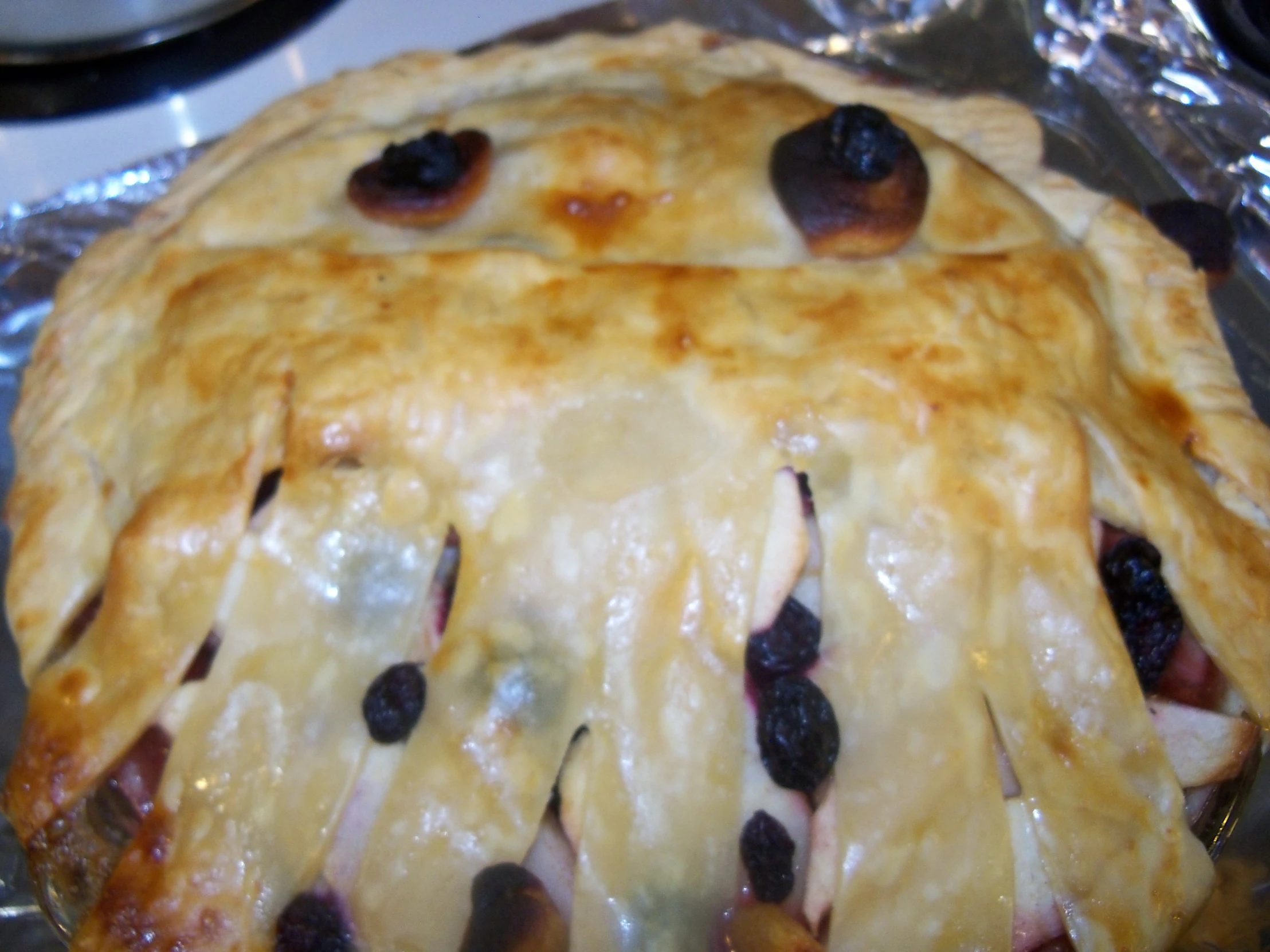 a baked dessert with blueberries and ham