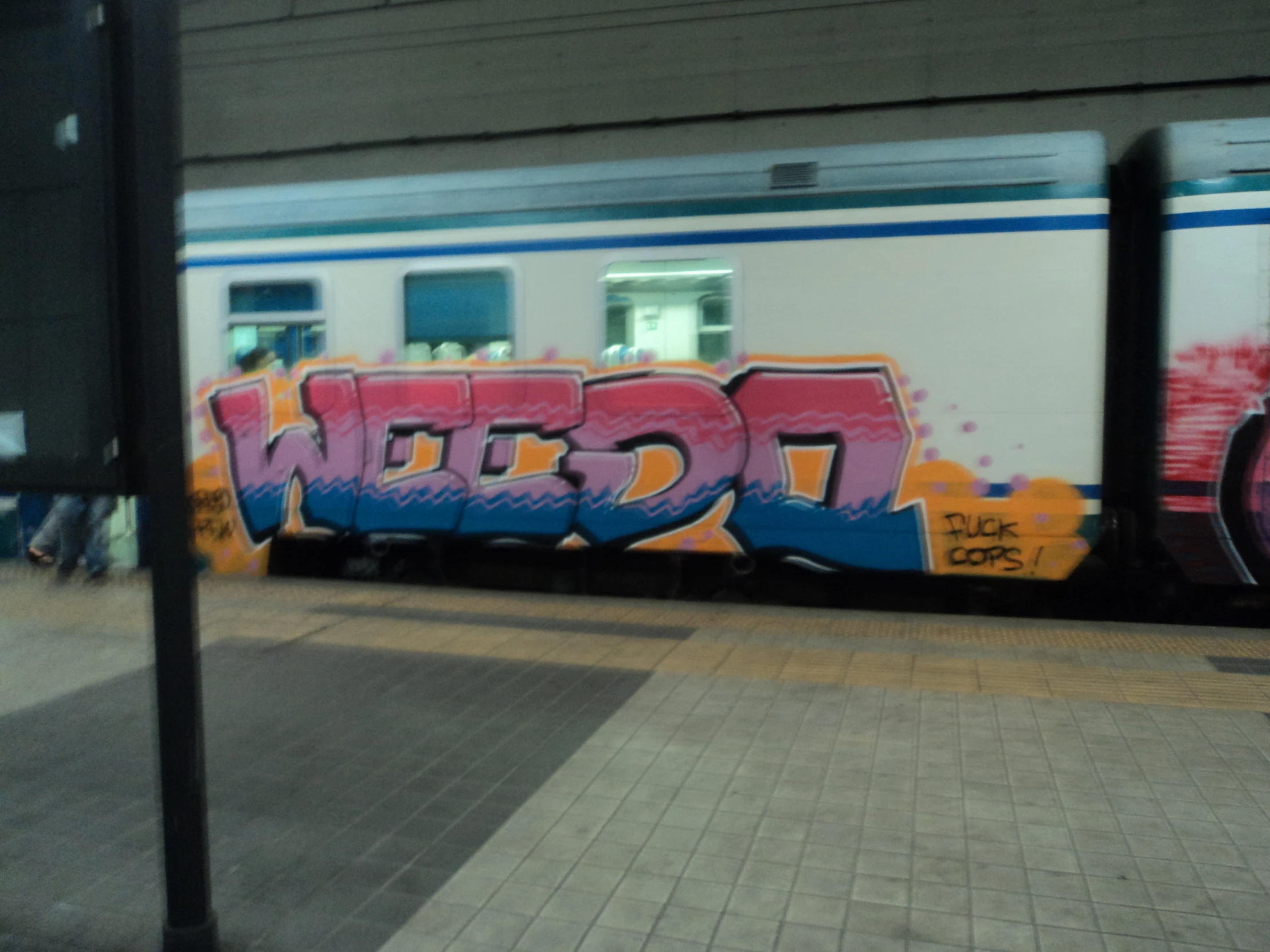 graffiti spray painted on the side of a train