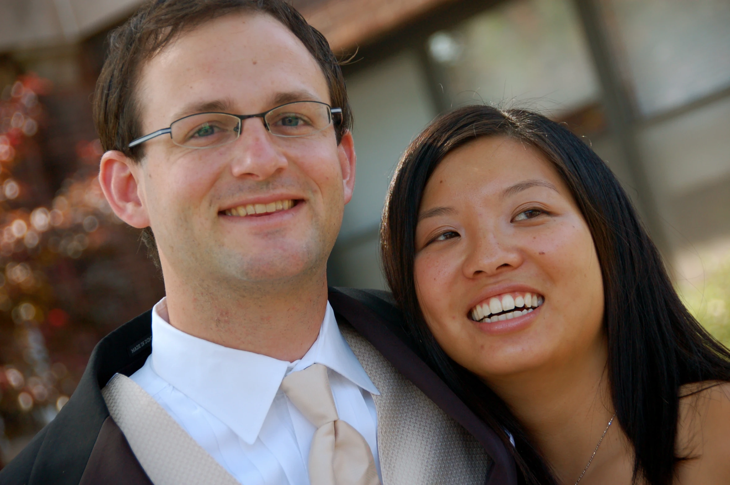 a beautiful young woman and man standing together