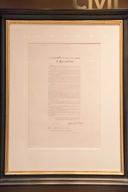 a framed document of president person at the time