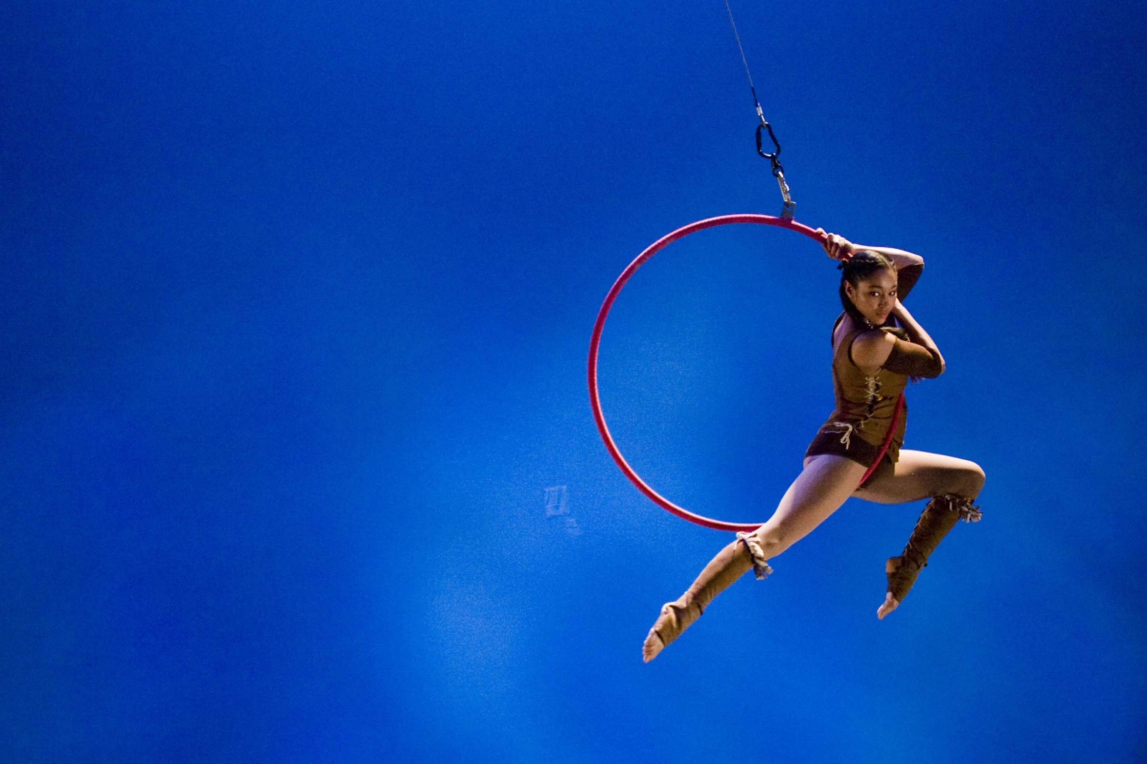 a woman performs aerial stunts in the air