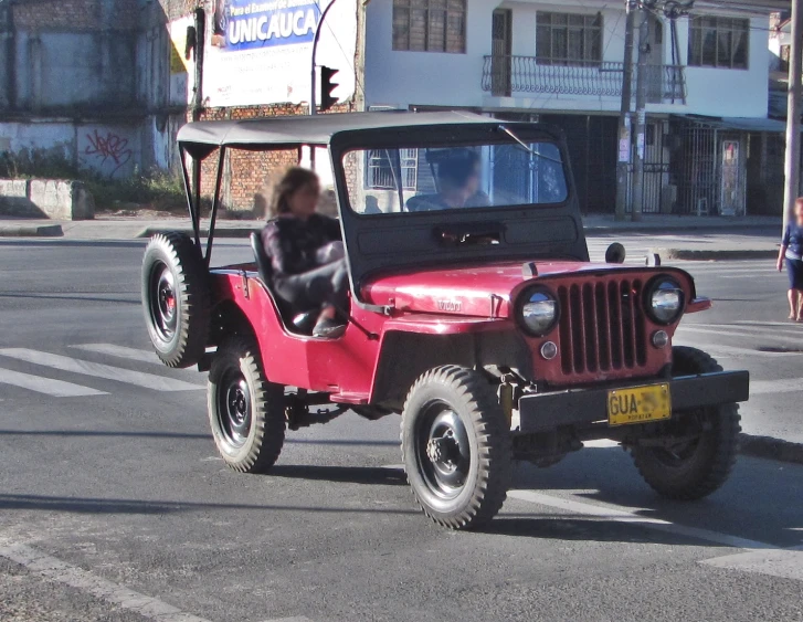 there is a woman that is driving in the cart