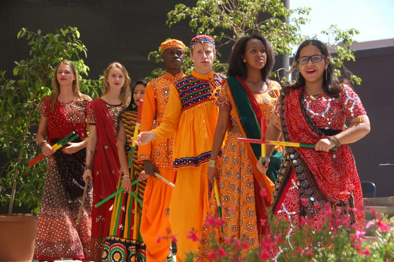 a group of young people wearing african american dress