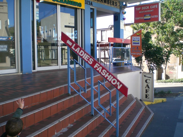 there is a sign at the top of a stair case