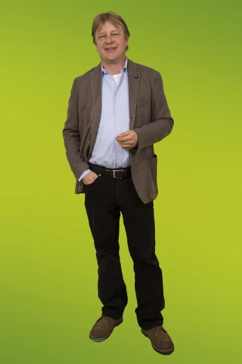 a man standing up with his hands in his pockets