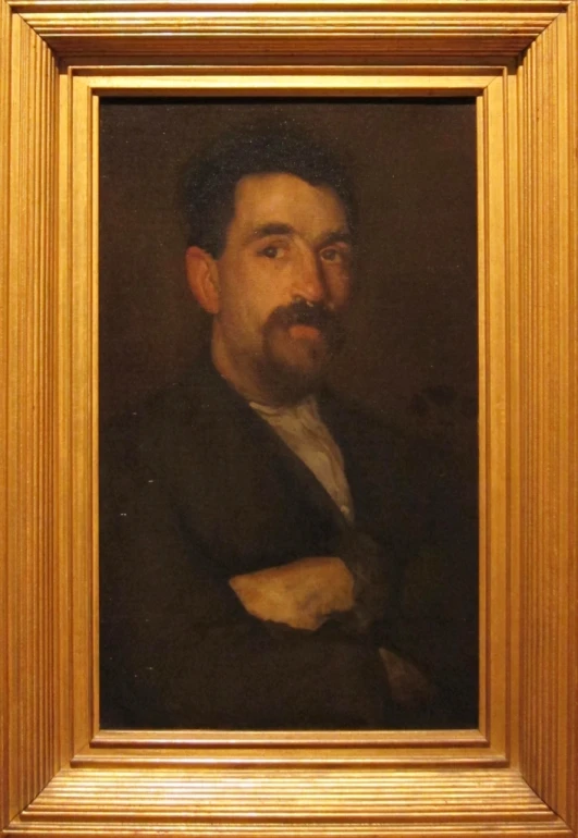 an oil painting of a man with a beard in a gold frame