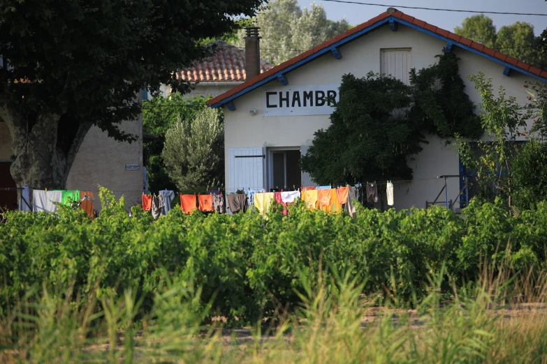 some colorful cloths are hanging from a clothes line