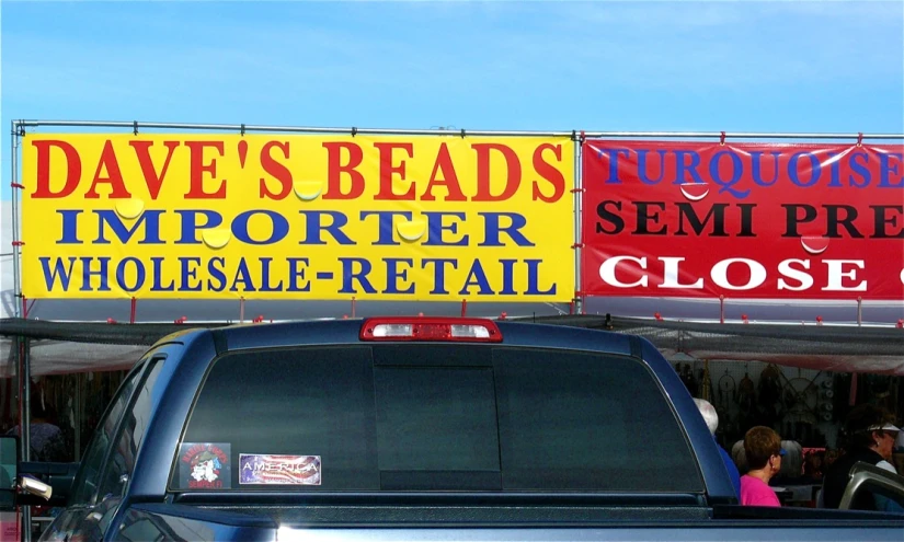 a truck with some signs on top of it