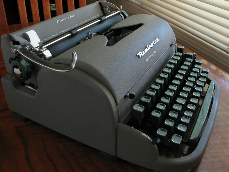 an old fashioned typewriter with a wooden back drop