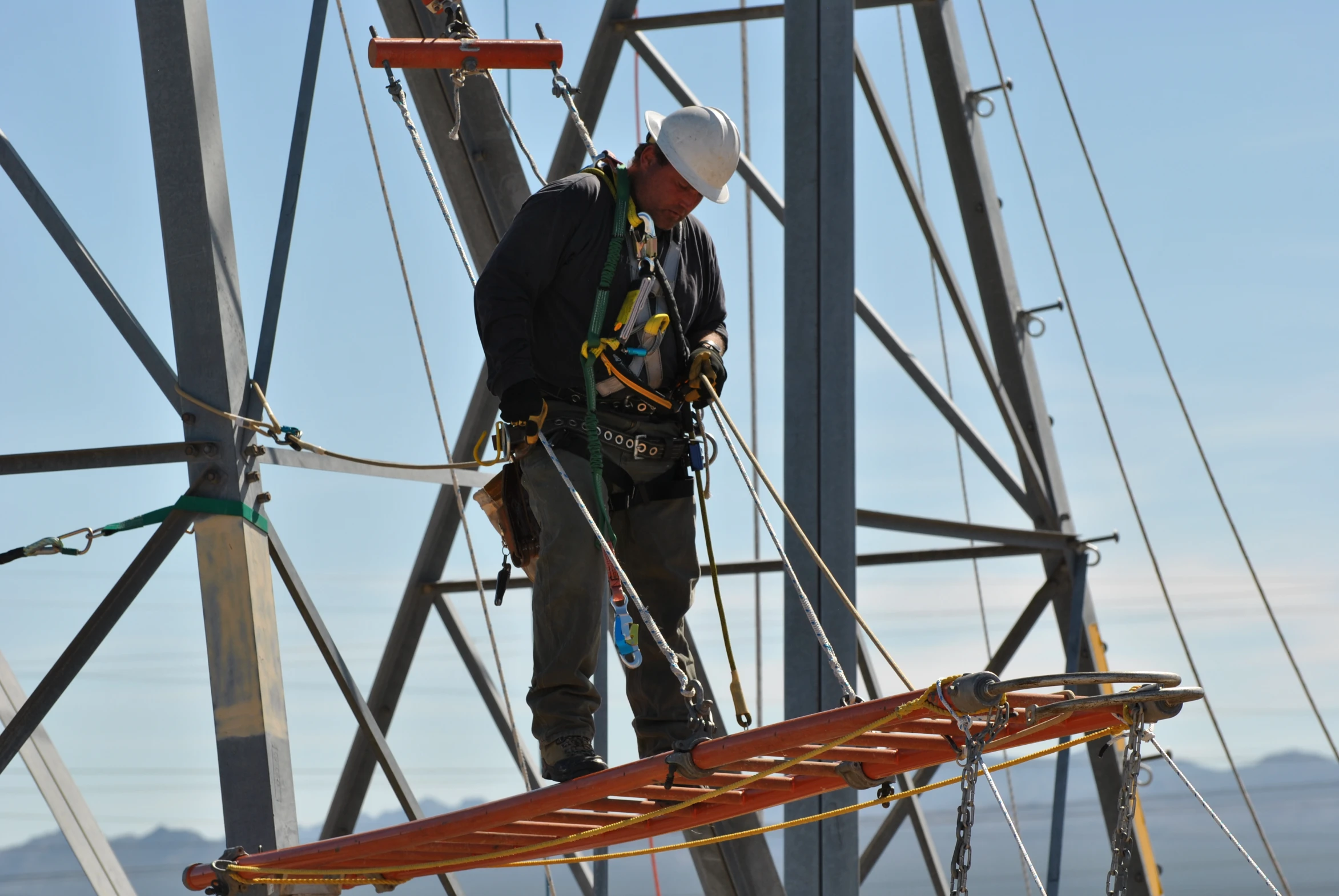 a man working on a wooden structure on a boat