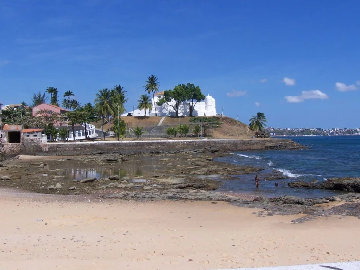 a small island with water at the beach