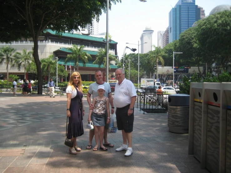 a group of people standing on a city street