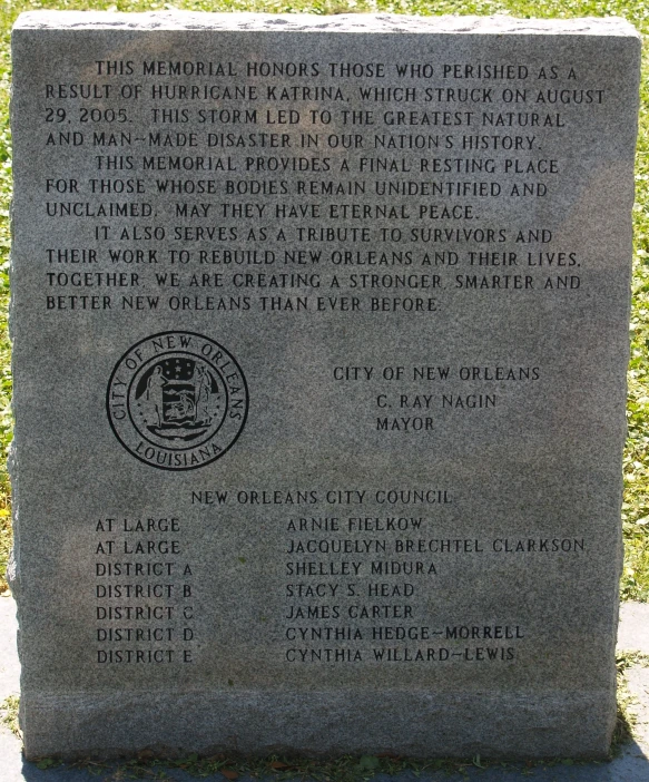 a granite memorial surrounded by grass