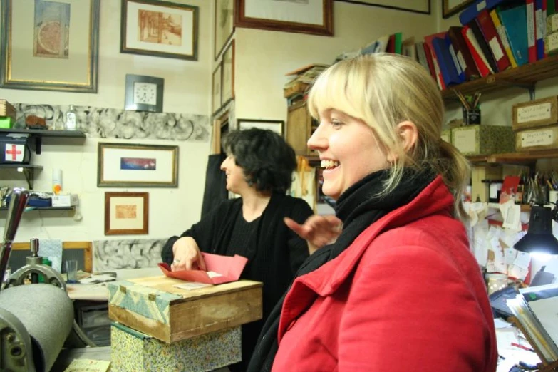 two women standing together in a home office