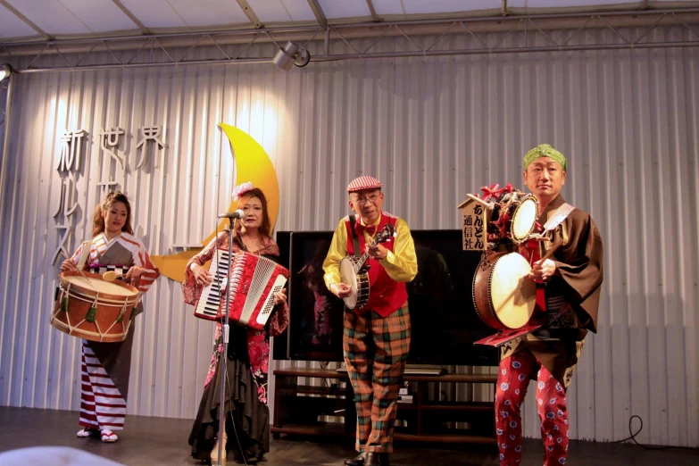 four people wearing costume and costumes playing instruments