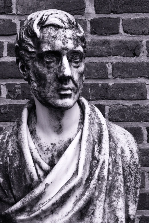 a black and white po of an ancient bust of a man