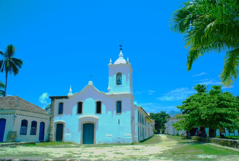 a church sits on the side of the road