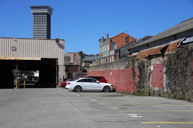 there is a car parked in an alley