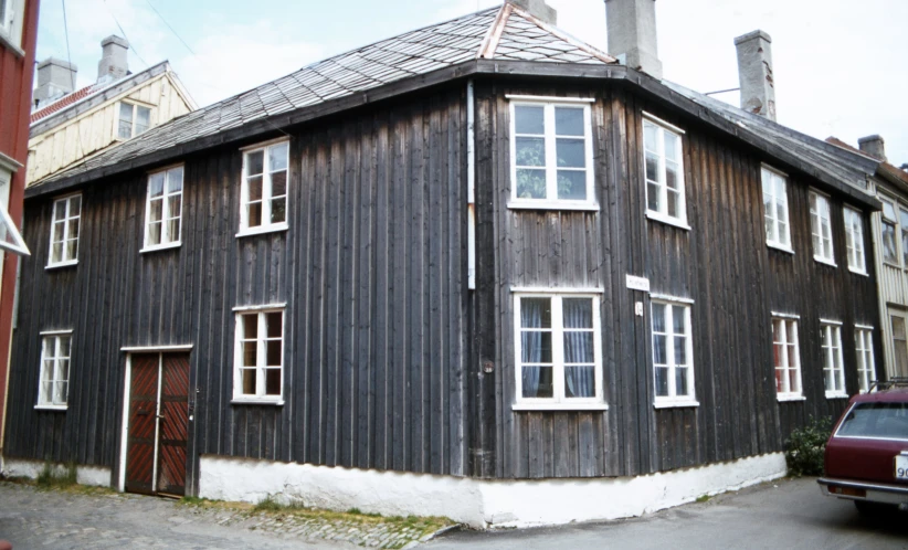 the exterior view of a house, showing its two sides