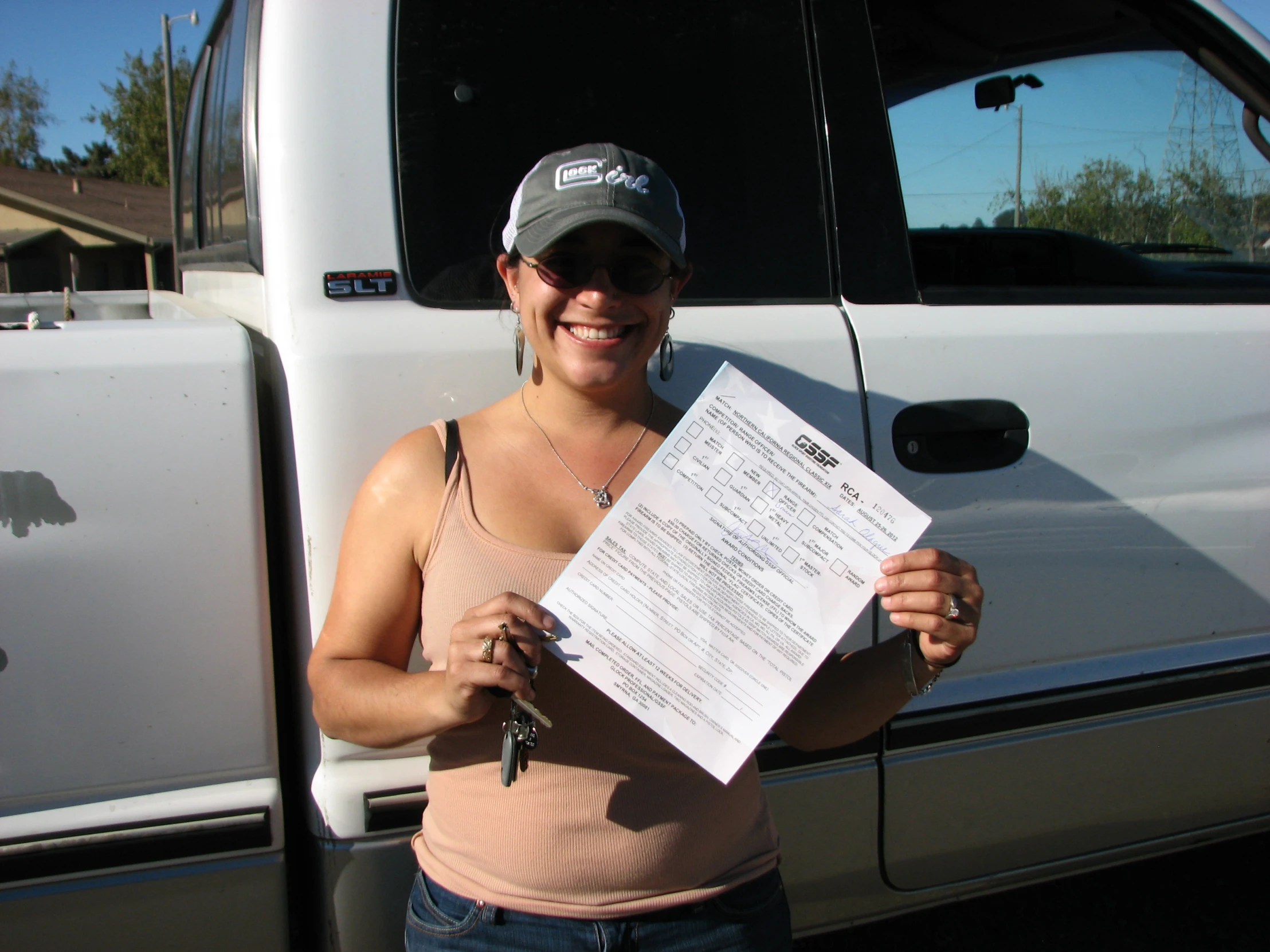 a lady showing off her new truck bill