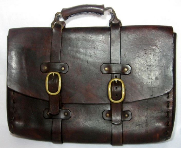 a close up of an old leather briefcase